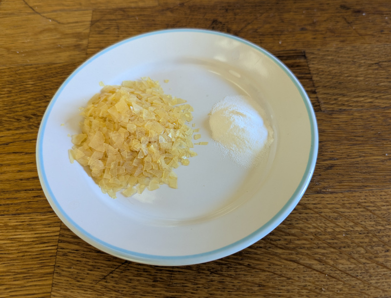 Shellac flakes and washing soda, ingredients for the water-based solution